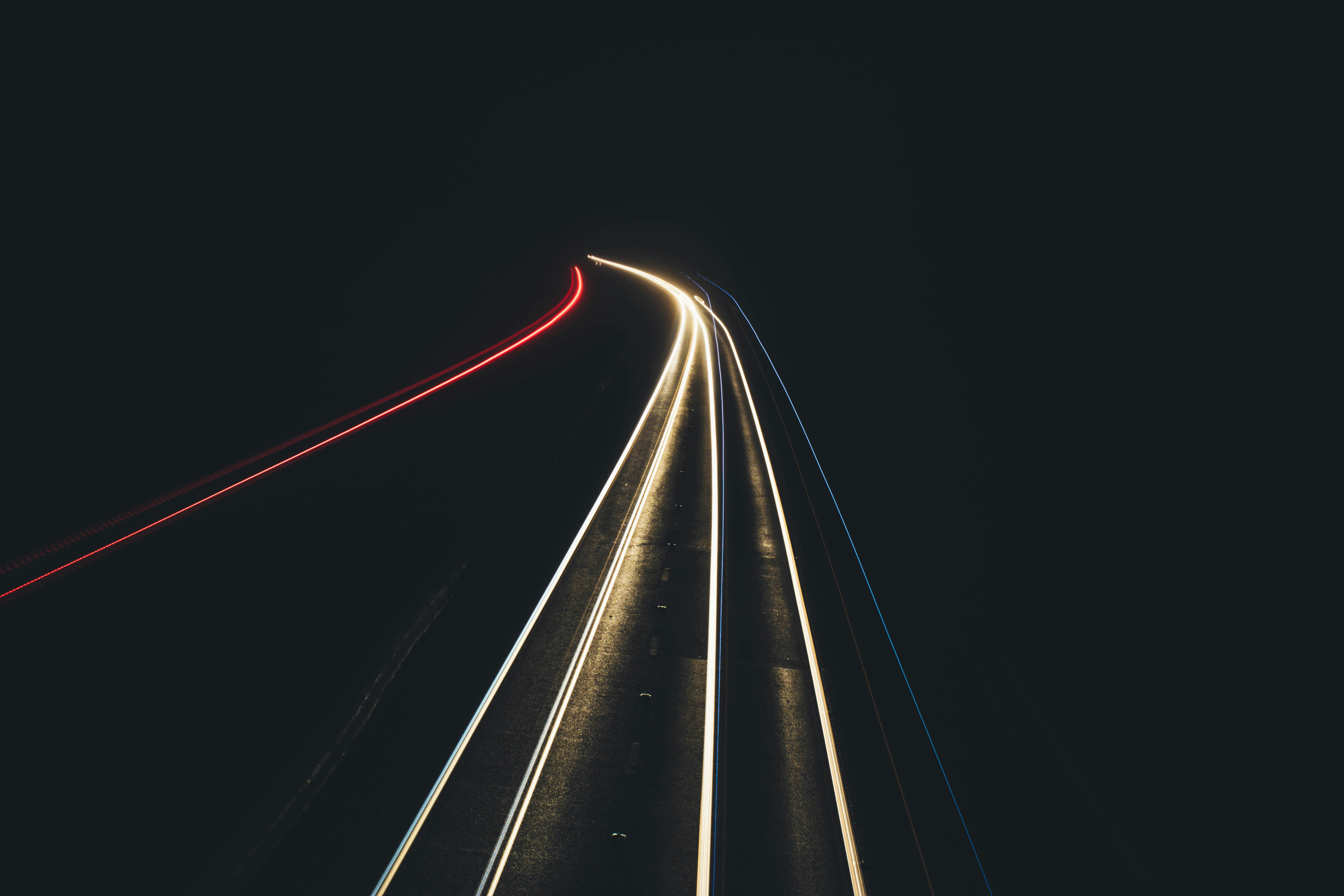 time lapse photography of lighted vehicle road